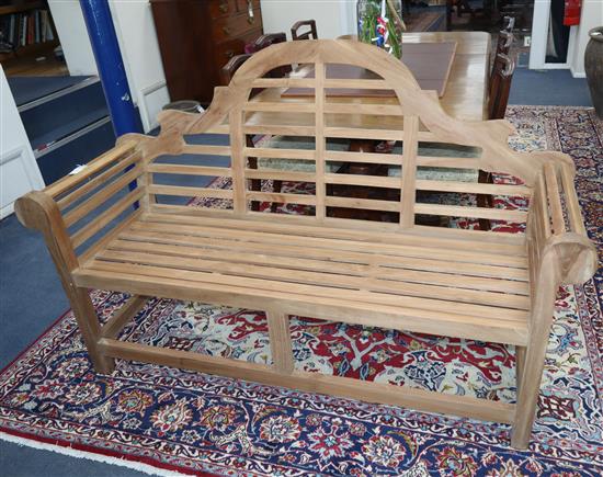 A Lutyens style teak garden bench W.166cm